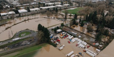 Aerial view of flooding in the Green River Basin taken Dec. 12. The photo shows fields and parking lots flooded with brown water.