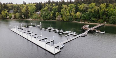 A marina with a treeline in the background